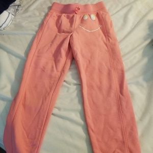 Coral colored sweat pants